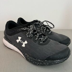 Black training shoes under armor
